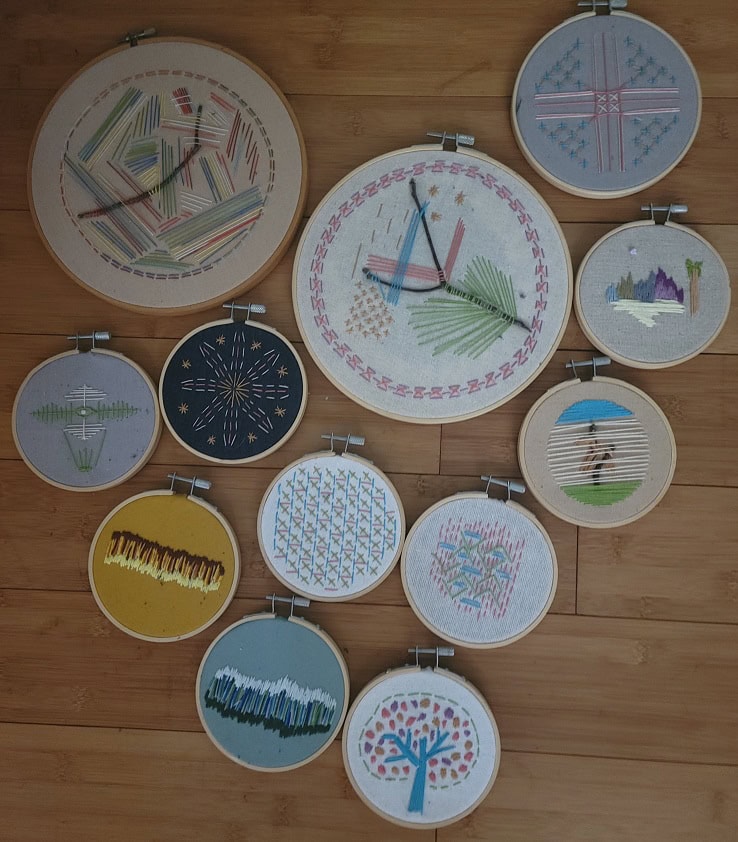 Original embroidery designs in hoops with finished backs
